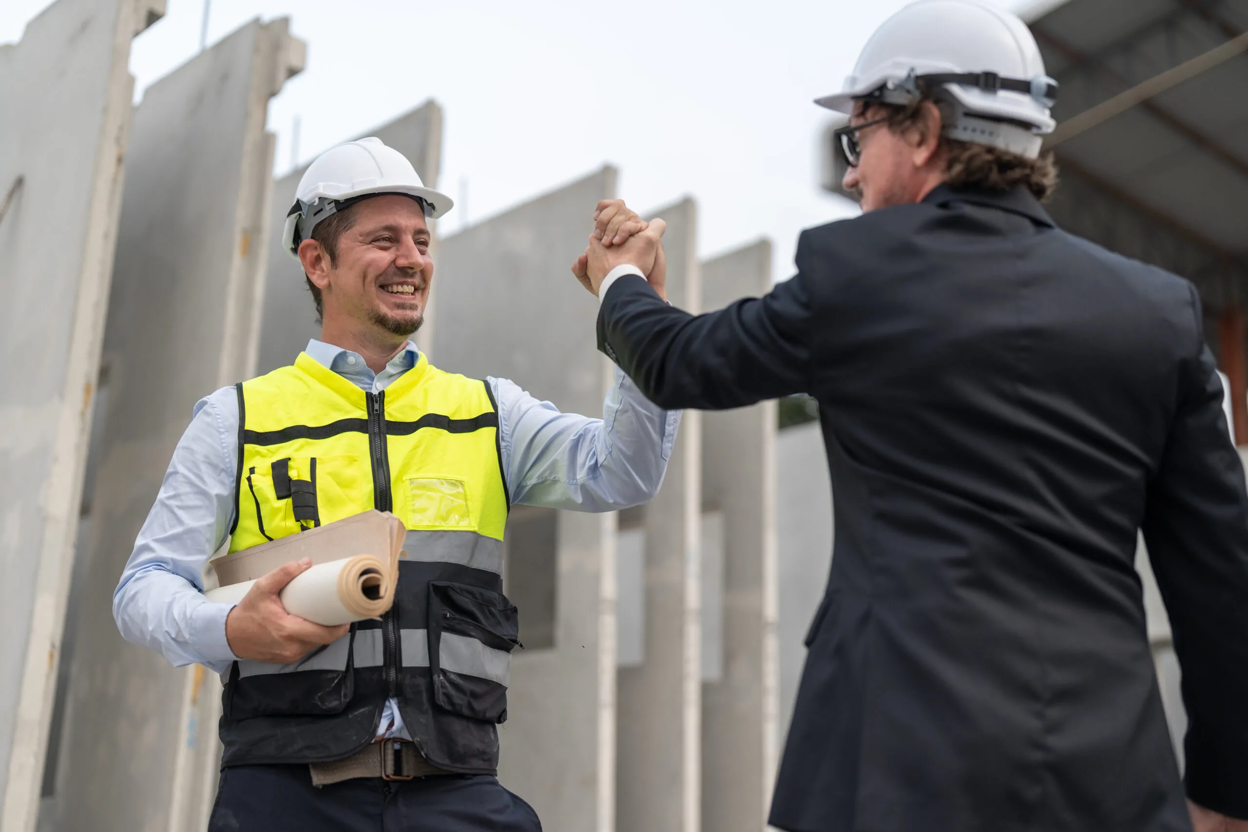 businessman and male engineer shaking hands after 2024 12 02 23 48 12 utc