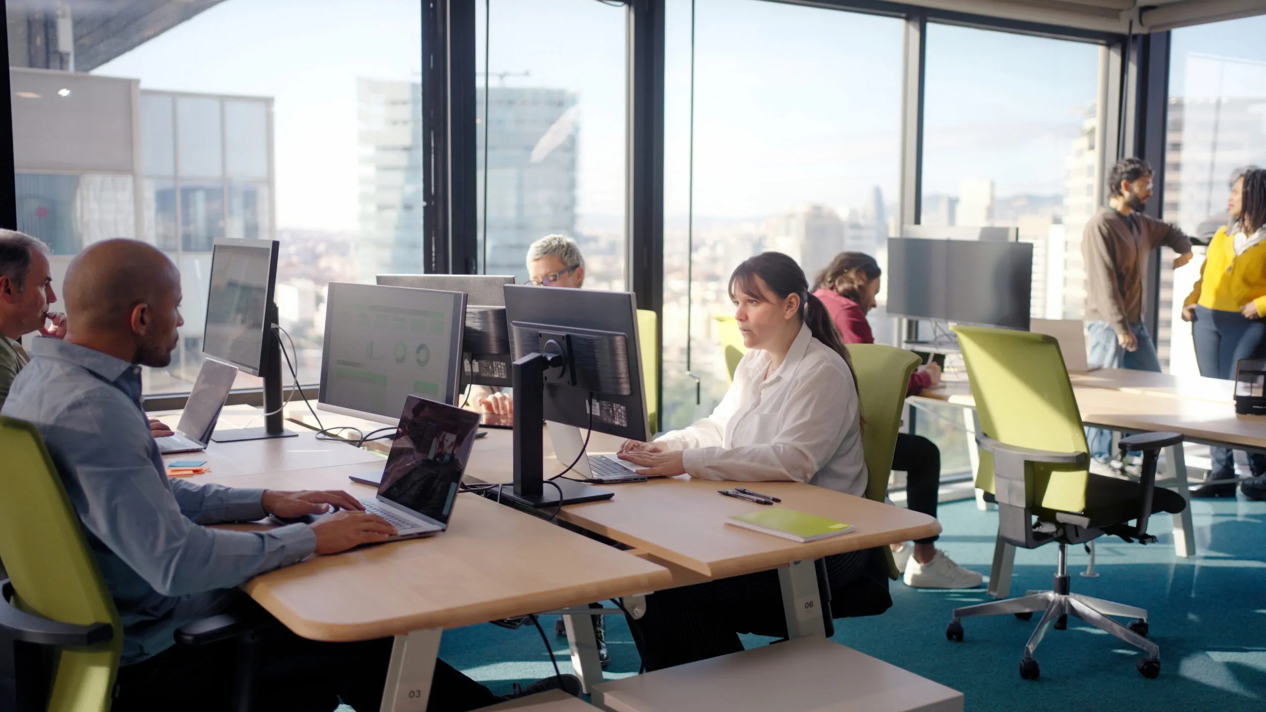 colleagues working with computers in modern office 2026 01 09 12 09 39 utc scaled